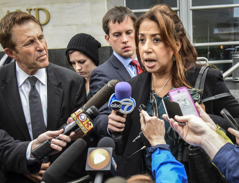 Maria Mena, attorney for one of the accused students, talks to the media as she departs the courthouse Friday in Rockville, Md. (Bill O’Leary/Washington Post)